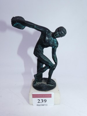 Lot 239 - A small bronzed metal figure of a male discus...