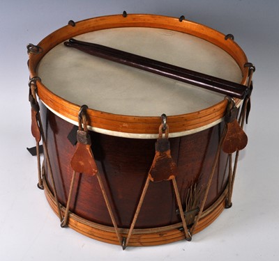 Lot 1012 - A snare drum of typical form, having a stained...