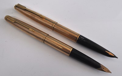 Lot 216 - Two Parker fountain pens in lined rolled...