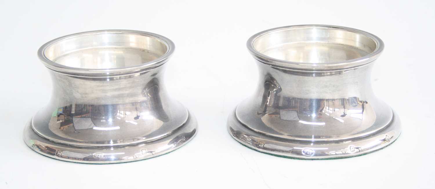 Lot 204 - A pair of contemporary silver candle-holders,...
