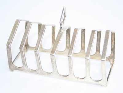 Lot 156 - An Art Deco silver six-division toast rack, of...