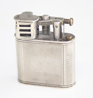 Lot 190 - A late Art Deco silver pocket lighter by...