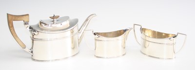 Lot 170 - An Art Deco silver three-piece tea set,...