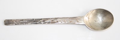 Lot 209 - A 1970s silver teaspoon, with pitted abstract...