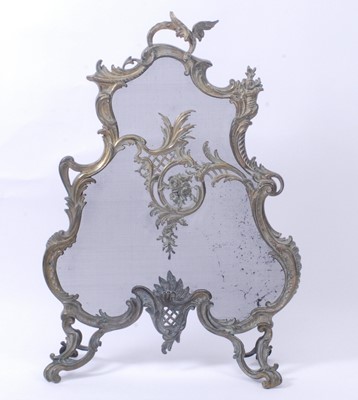 Lot 2612 - A Rococo Revival brass sparkguard, the swept...