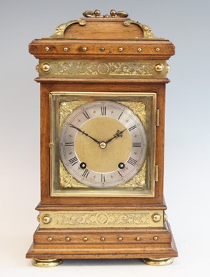 Lot 2582 - A late 19th century walnut cased mantel clock...