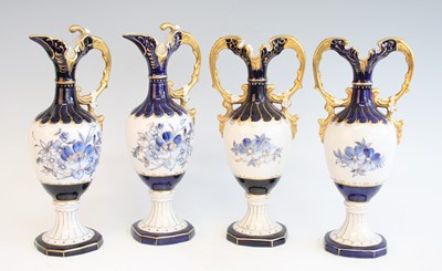 Lot 2097 - A pair of Royal Dux porcelain pedestal ewers,...