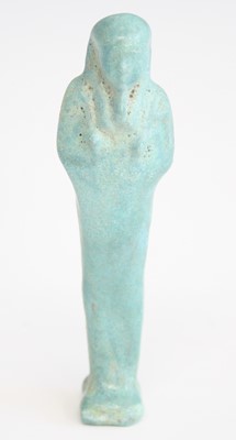 Lot 2362 - An Egyptian blue faience shabti figure, carved...