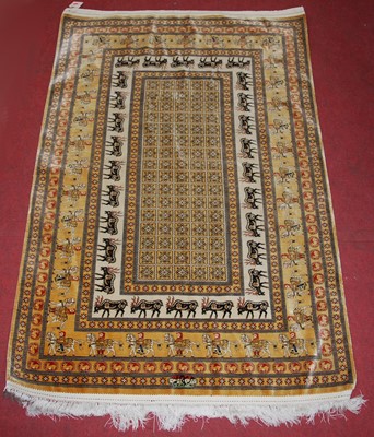 Lot 2638 - A Persian woven silk fineweave rug, the...