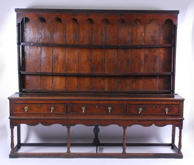 Lot 2627 - A George III joined oak dresser, the upper...