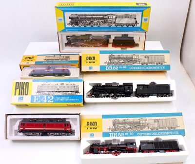 Lot 490 - A Piko H0 gauge boxed diesel and steam outline...