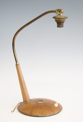 Lot 266 - A 1950s walnut and brass desk lamp, the fixed...