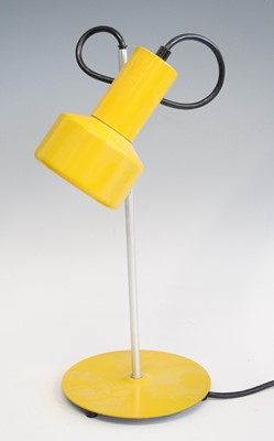 Lot 267 - A 1980s yellow painted metal desk lamp, having...