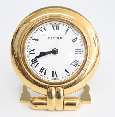Lot 261 - A Cartier 'Colisee' gilt brass travel alarm...
