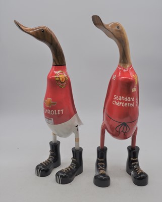 Lot 7 - Two carved wooden model of ducks in football...
