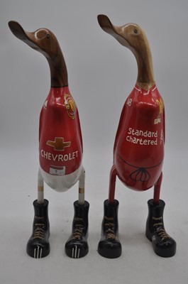 Lot 7 - Two carved wooden model of ducks in football...