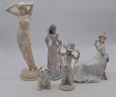 Lot 41 - A collection of four Spanish porcelain figures,...