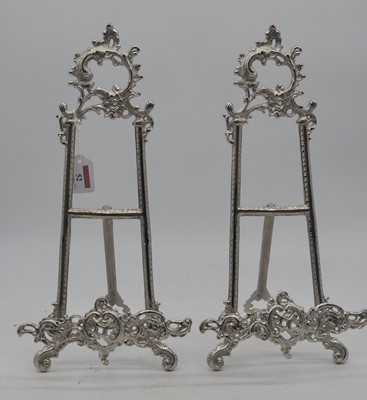 Lot 52 - A pair of reproduction Rococo-style white...