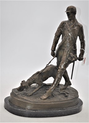 Lot 55 - A bronze figure of a huntsman and his dog,...