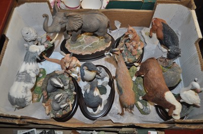Lot 61 - A collection of various resin animal figures...