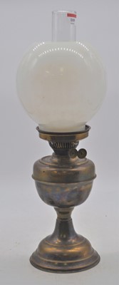 Lot 105 - A Victorian brass oil lamp, having a milk...