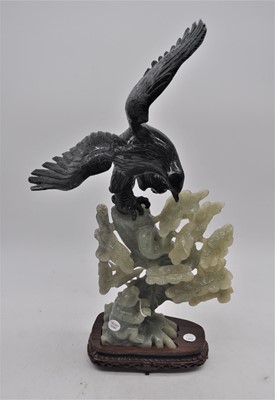 Lot 110 - A jadeite carving of an eagle on a pine tree,...