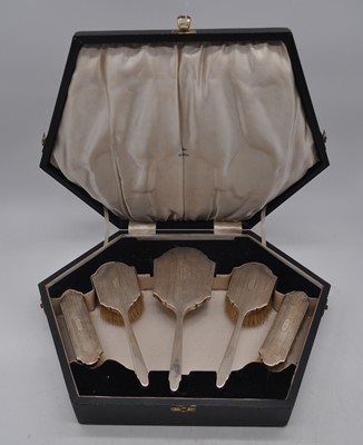 Lot 121 - A cased George V silver five piece dressing...