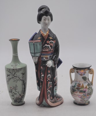 Lot 191 - A Japanese earthenware figure of a geisha,...