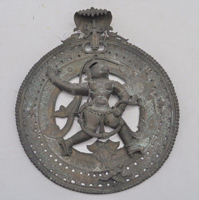 Lot 164 - An Indian brass roundel, relief decorated with...