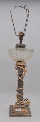 Lot 31 - An Edwardian silver oil lamp having a cut...