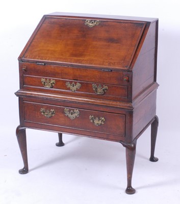 Lot 2634 - An antique oak and crossbanded bureau, the...