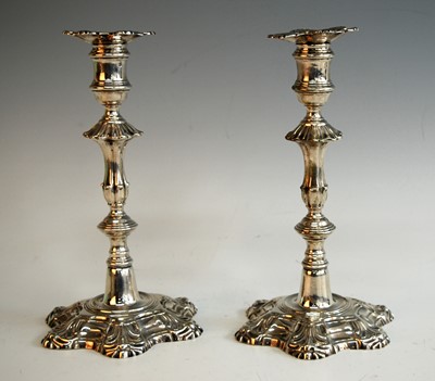 Lot 2136 - A pair of George II cast silver candlesticks,...