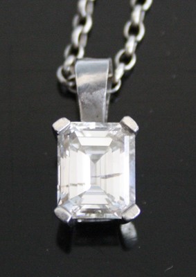 Lot 2228 - A white metal emerald cut diamond single stone...