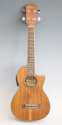 Lot 1218 - An Ashbury semi-electric four string ukulele,...