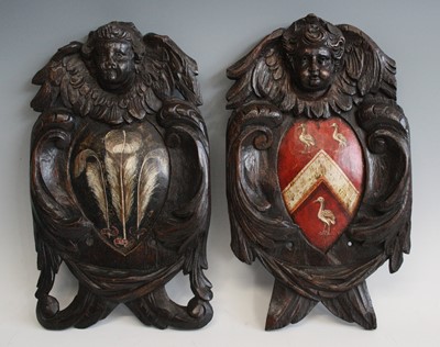 Lot 2318 - A pair of 18th century carved oak armorial...