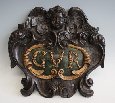 Lot 2319 - An 18th century carved oak armorial...