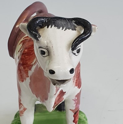 Lot 2085 - A circa 1830 Swansea pearlware cow creamer,...