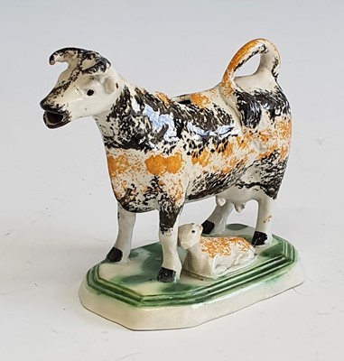 Lot 2086 - A circa 1810 Yorkshire pearlware cow creamer,...