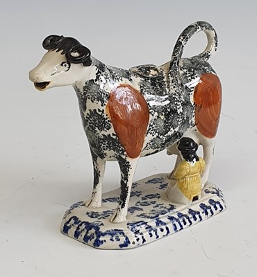 Lot 2087 - A circa 1810 Yorkshire pearlware cow creamer,...