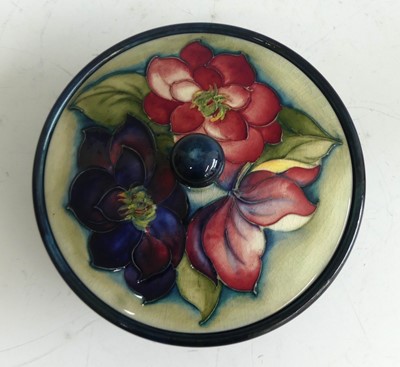 Lot 31 - A Moorcroft Clematis pattern pottery jar and...