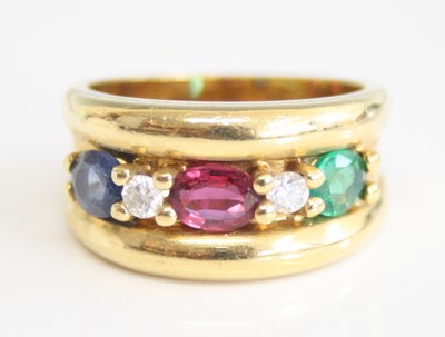 Lot 2210 - A yellow metal, sapphire, ruby, emerald and...
