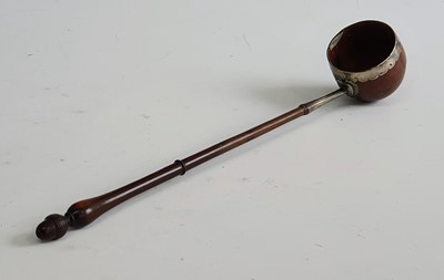 Lot 2314 - An 18th century toddy ladle, the coquilla nut...