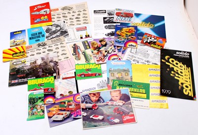 Lot 1602 - A collection of various toy brochures and...