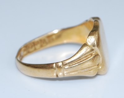 Lot 2534 - An 18ct yellow gold shield shaped signet ring,...