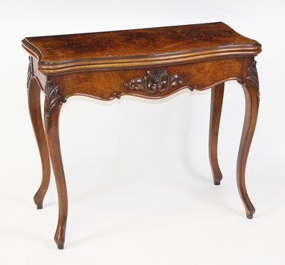 Lot 2641 - A Victorian figured walnut card table in the...