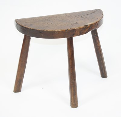 Lot 2643 - An antique primitive fruitwood stool, probably...