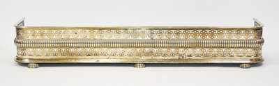 Lot 2647 - A circa 1830 brass fire fender, having a...