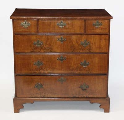 Lot 2651 - A George II walnut chest, having a crossbanded...