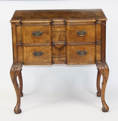 Lot 2652 - A figured walnut two-drawer side table in the...