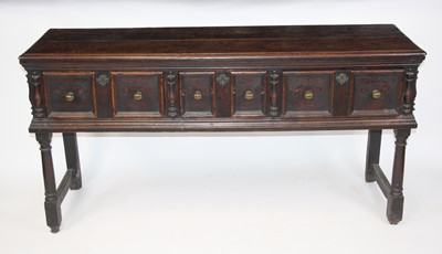 Lot 2661 - An 18th century and later joined oak dresser...